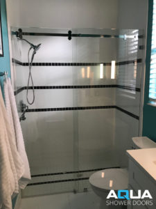 Frameless Serenity Barn Style Installation - AQUA Shower Doors in Sarasota Florida